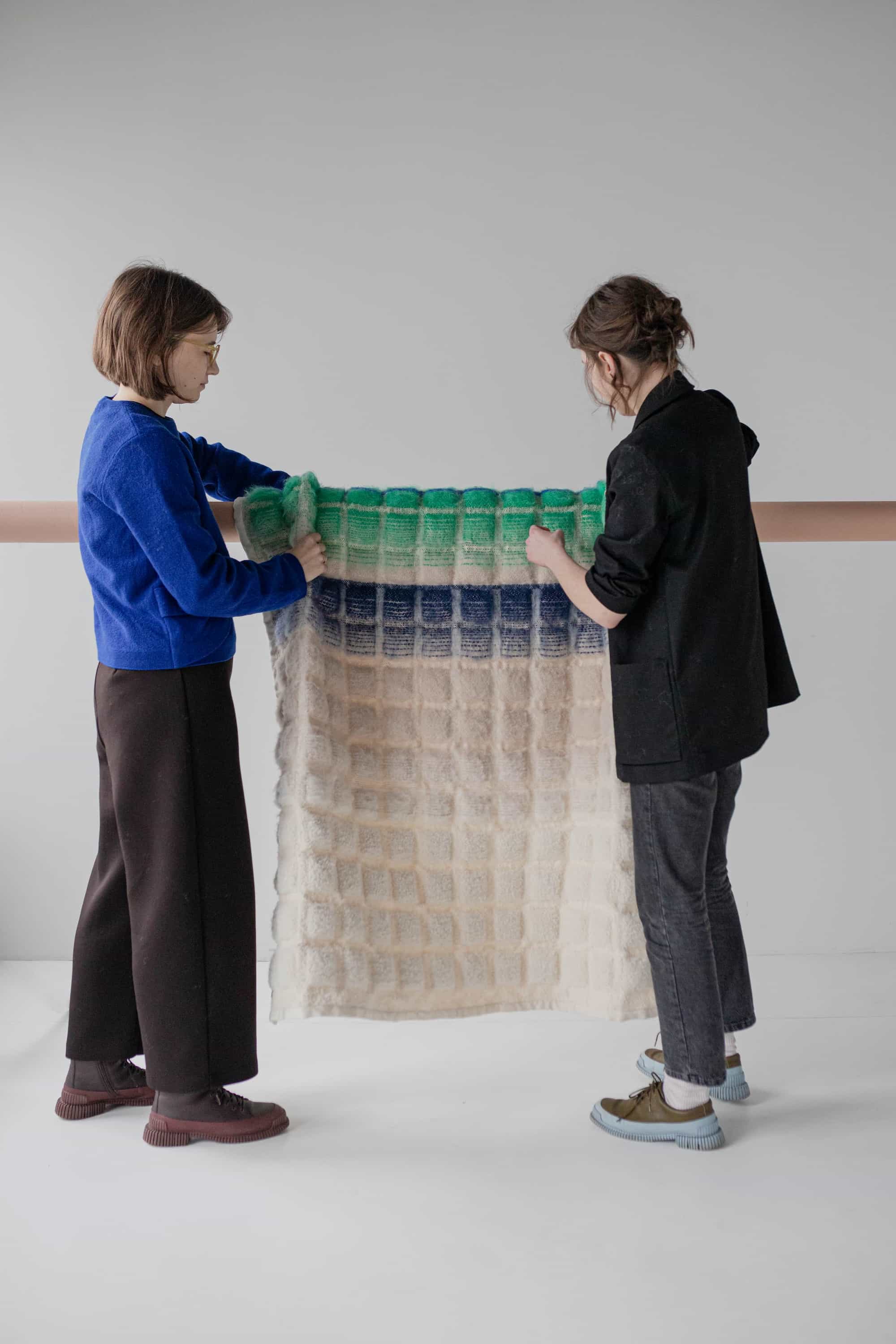 Julia and Dominika holding blur blanket