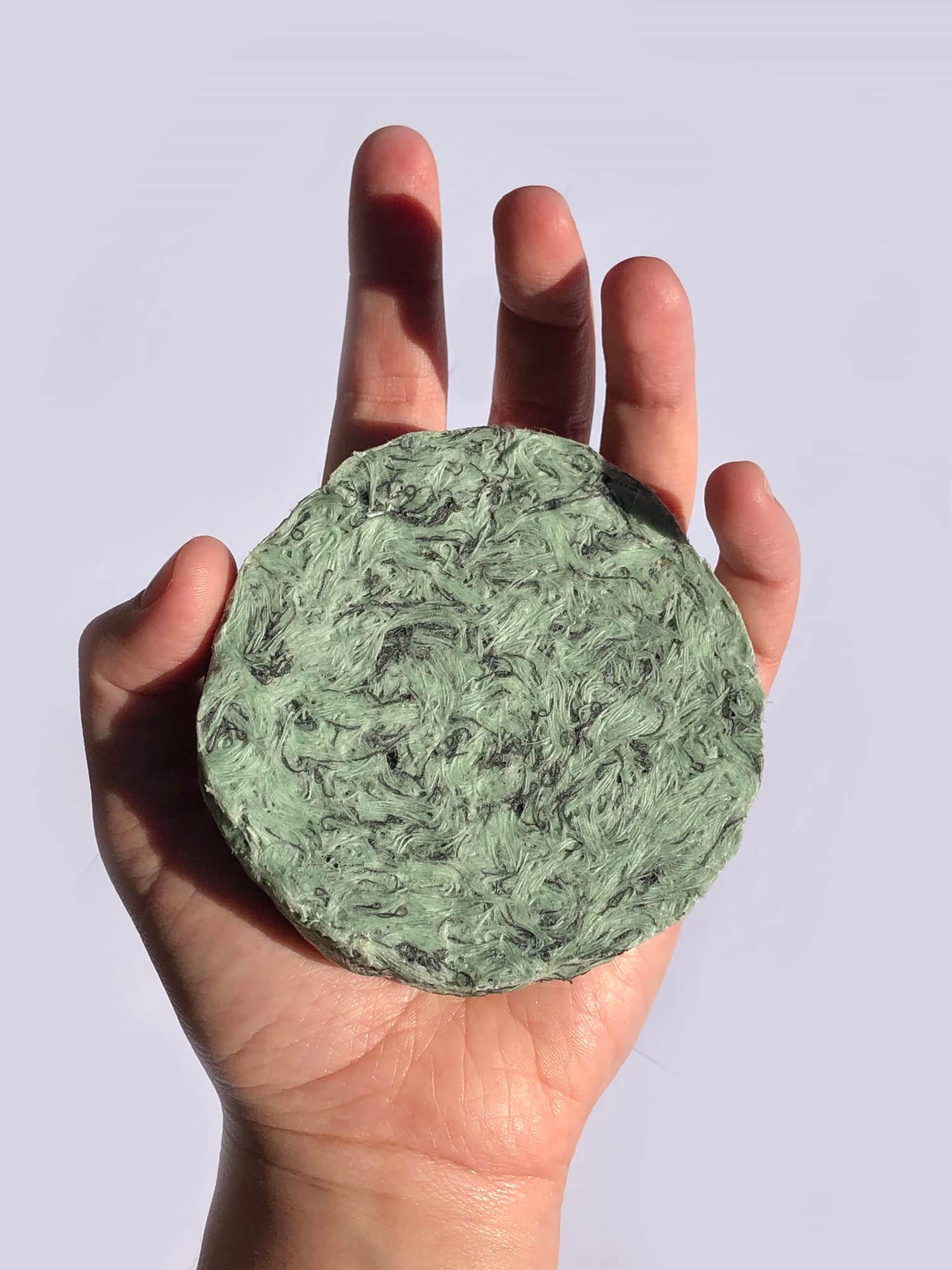 hand holding object made with RESTKI material